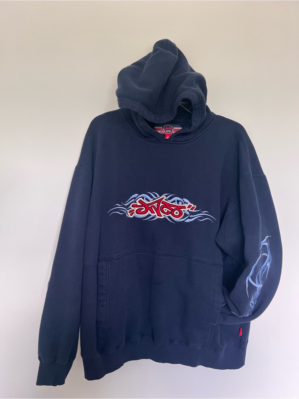 JNCO Navy Hoodie with Red and White Crest Graphic